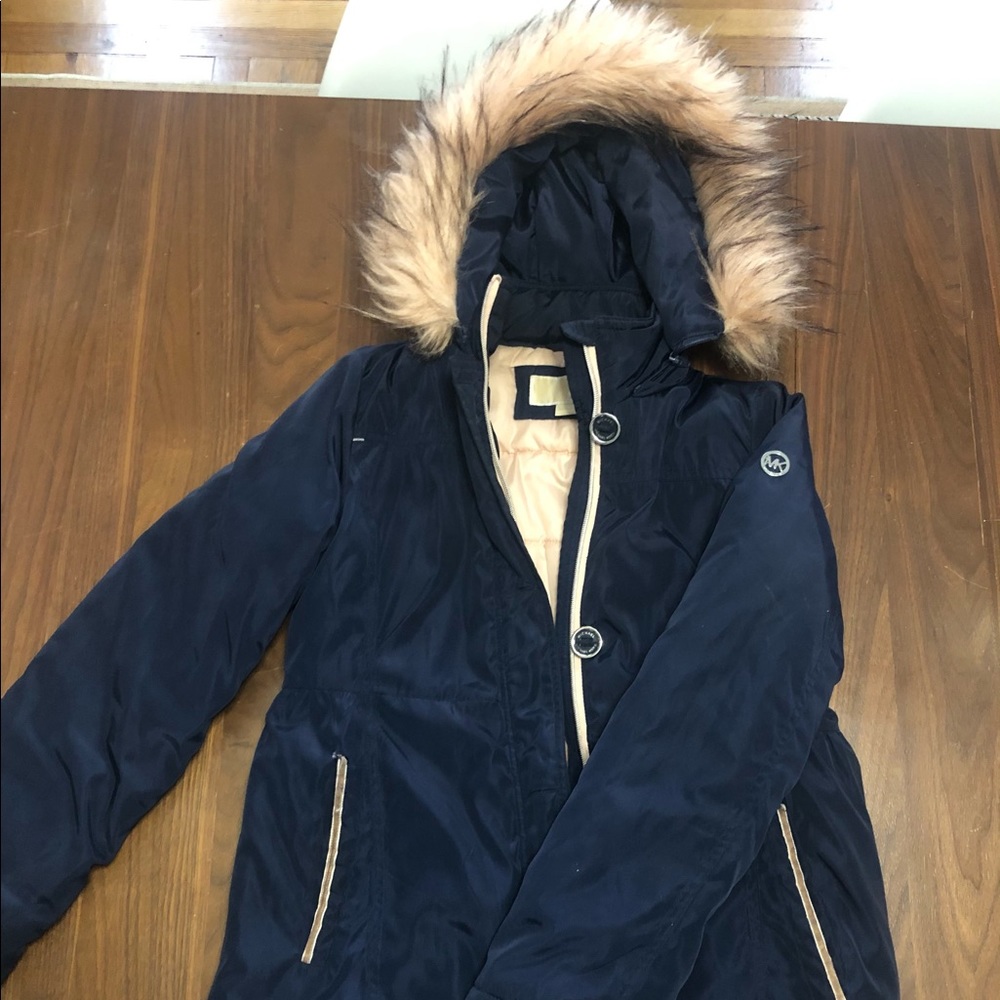 Navy blue coat with Faux Fur trim is light pink